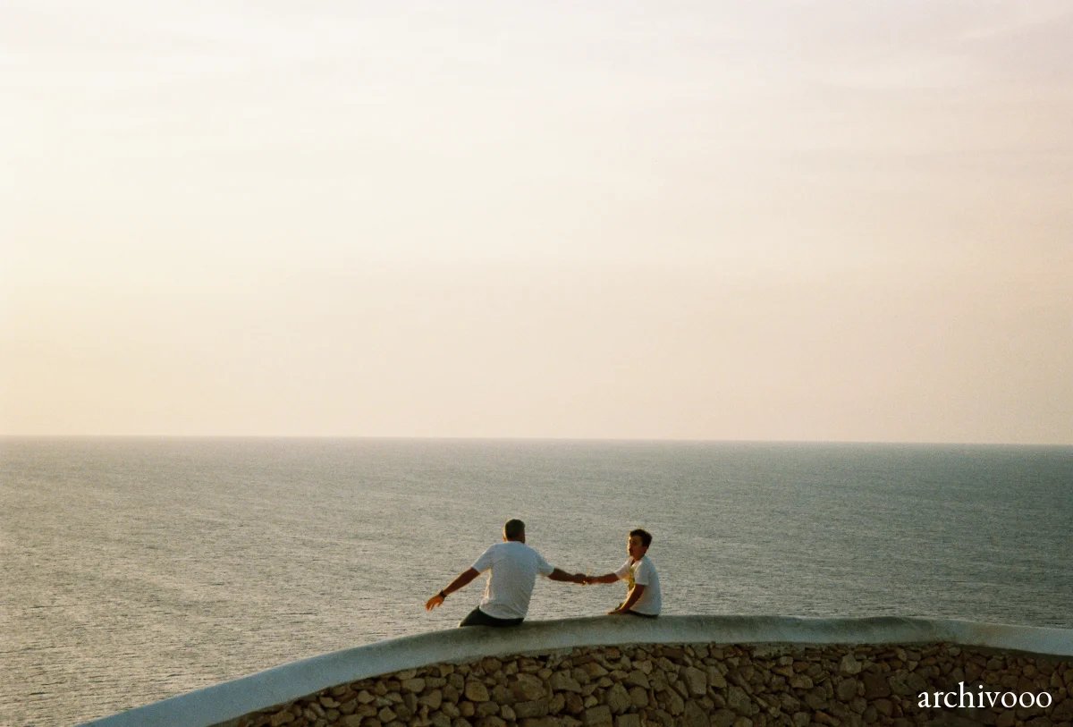 Father and son watching the sunset